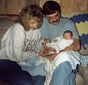 Click here to see a larger image. This a picture of myself, my husband and our first grandchild.  It was taken 4 years ago when Chance was born.
